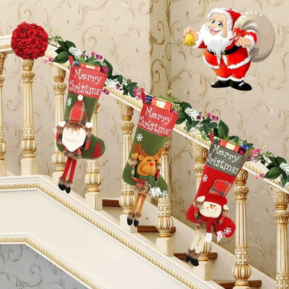 Set of three large red, white, and brown Christmas stockings with 3D Santa, Snowman, and Reindeer designs hanging on a tree.