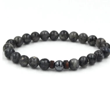 Stylish men's bracelet made with natural volcanic stone, flash stone, and wood chip in a geometric, mosaic-like design