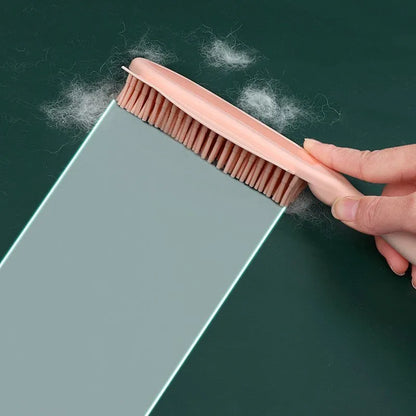 Green silicone pet grooming brush with flexible bristles for removing hair from cats, dogs and furniture