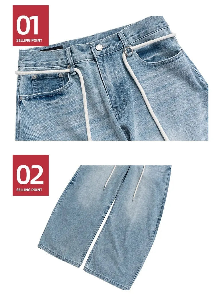Blue vintage washed straight-leg denim trousers with a drawstring waistband on a hanger.