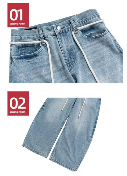 Blue vintage washed straight-leg denim trousers with a drawstring waistband on a hanger.