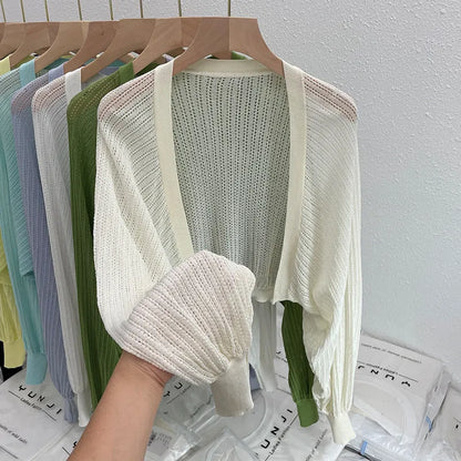 Long sleeve polyester blouse with lantern sleeves and hollow detail in apricot colour.