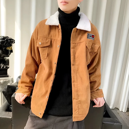 Men's loose fit corduroy work jacket in khaki on a hanger.
