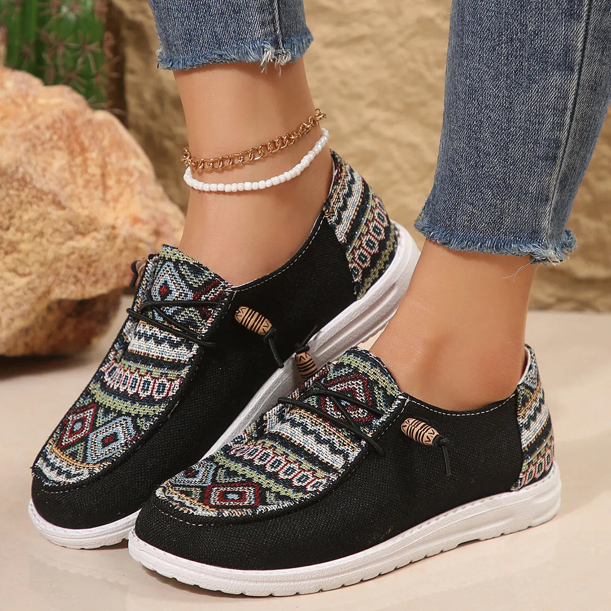 Women's black round toe flat shoes with low-top design and elasticated oversleeves