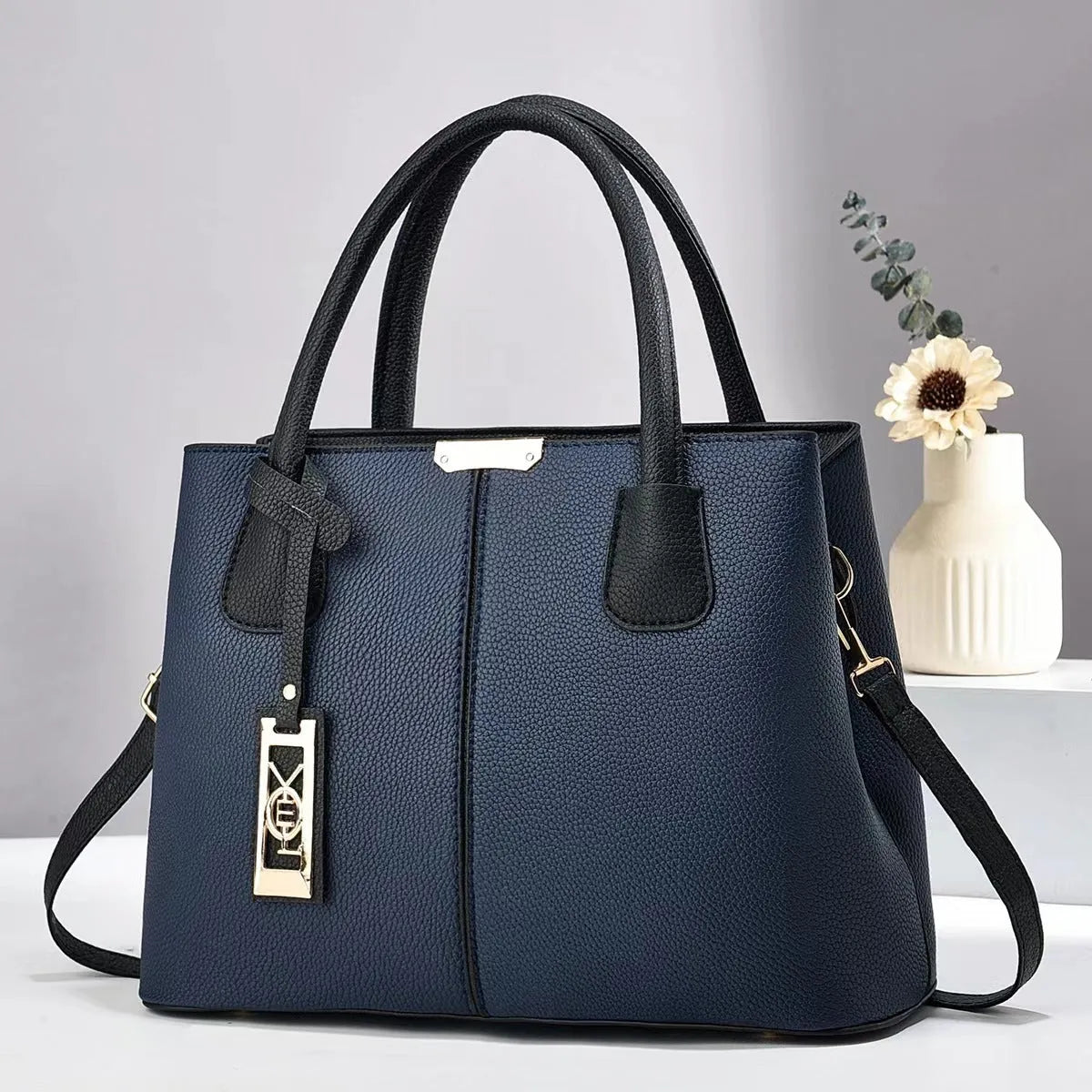 Soft PU leather large capacity shoulder bag in a horizontal square shape with an adjustable strap