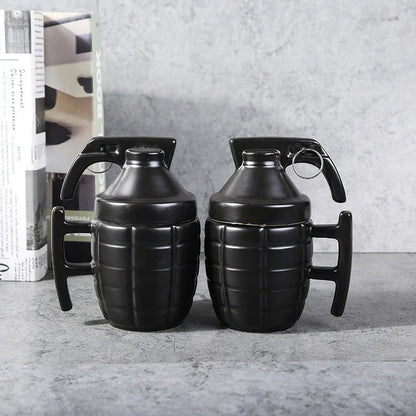 A white or black ceramic coffee mug with a grenade-inspired design and a secure lid for on-the-go convenience.