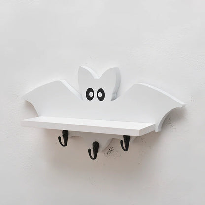 White pine animal-shaped wall shelf measuring 35cm wide by 17cm high on wall