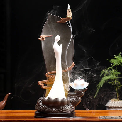 Purple sand tea pet backflow fragrance ornament with LED lighting creating cascading smoke effect