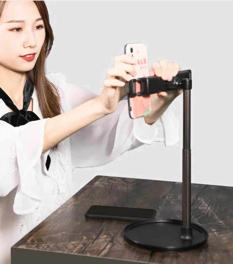 Black foldable phone and tablet stand with expansion clip and silicone grip, fits 4.7-15.6 inch devices