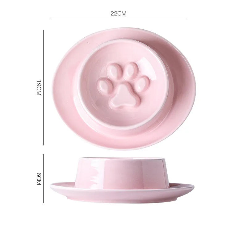 Green ceramic slow feeder bowl for pets with high walls and a non-slip rubber base.
