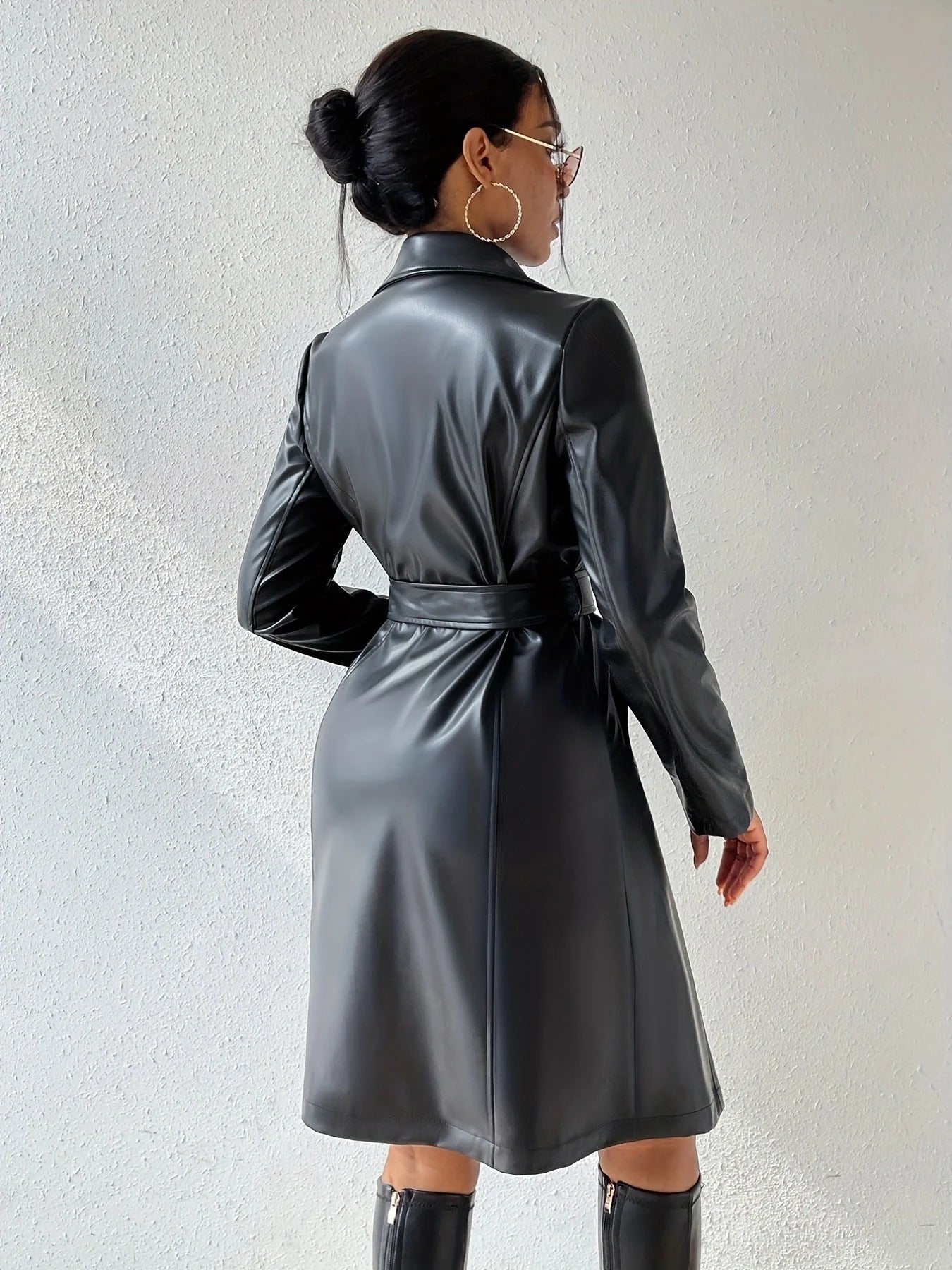 Women's long sleeve faux leather trench coat in various colors with pockets and slim fit design