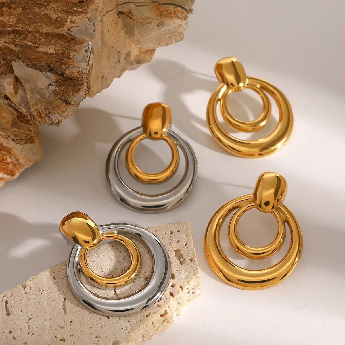 Round geometric hollow stud earrings in gold with 1.2cm diameter and centre cut-out design