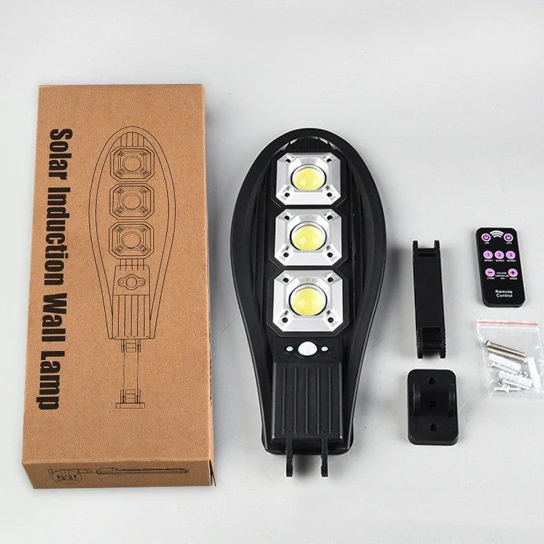 Solar street LED light with 55cm housing, white illumination, and remote control for outdoor garden security