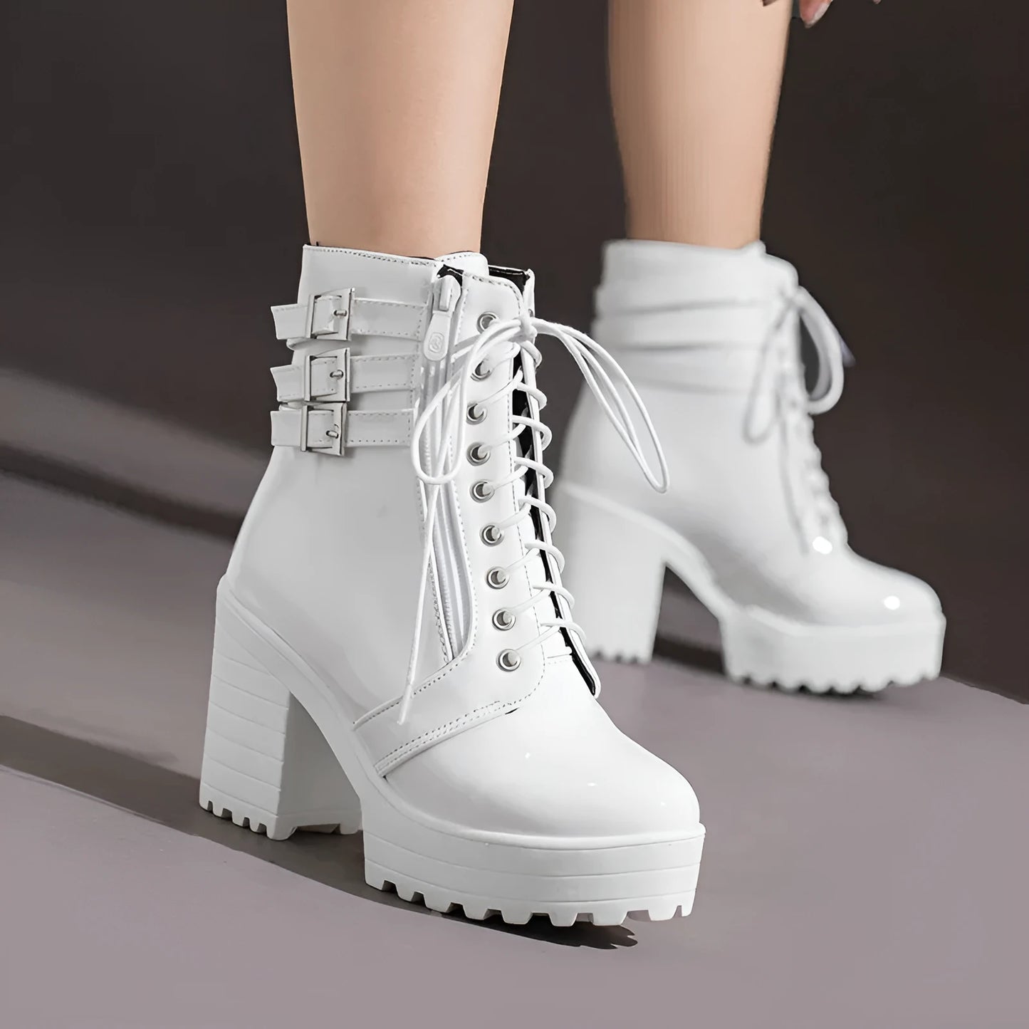 Women's black chunky heel ankle boots with round toe and front lace-up on a waterproof platform sole.