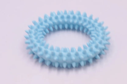 TPR spiky circle ring dog chew toy in assorted colours showing dental cleaning nubs