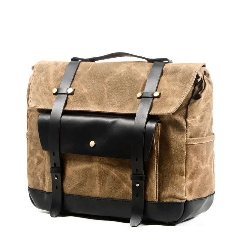 Camel Bag Knight retro cotton messenger bag in army green, showing front flap, rivet details, and size next to a motorcycle helmet.