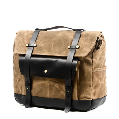 Camel Bag Knight retro cotton messenger bag in army green, showing front flap, rivet details, and size next to a motorcycle helmet.
