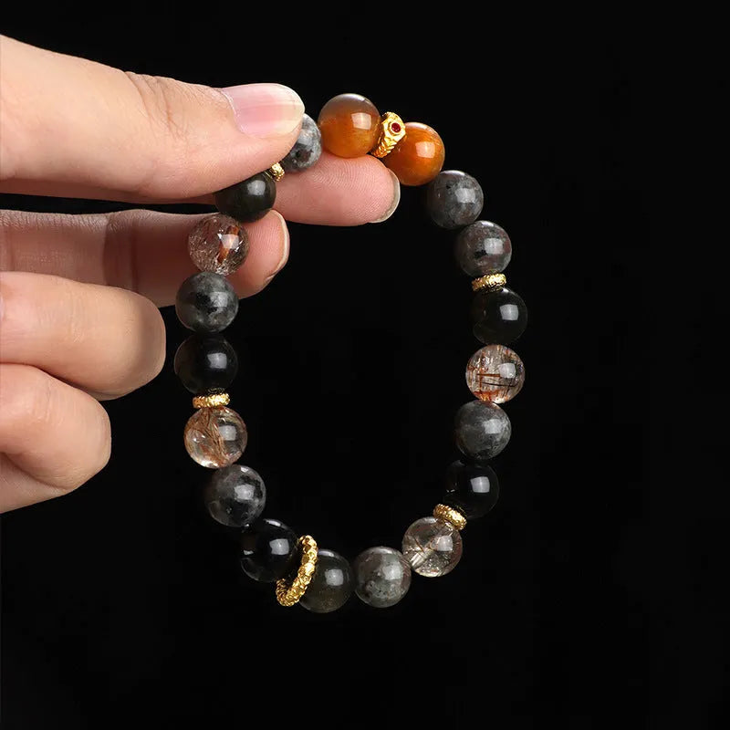Handcrafted black Sunstone flame stone Wukong bracelet on wrist showing stone bead detail
