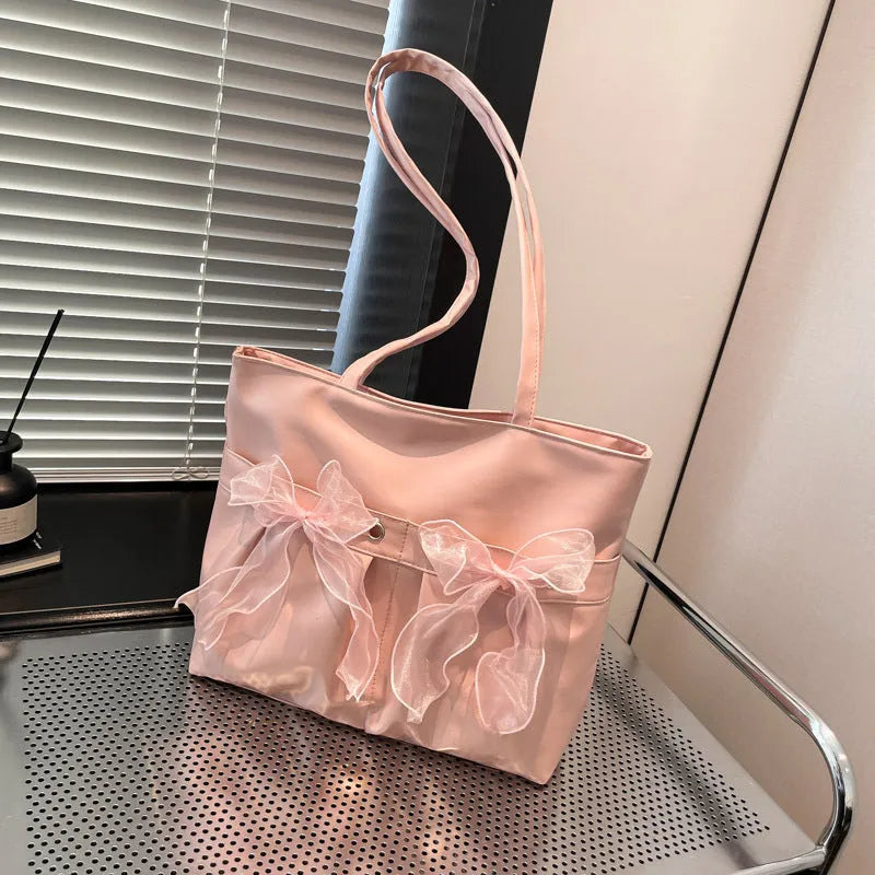 College style bow tote bag with large main compartment and internal zipper organiser in black colour