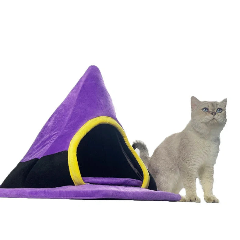 Purple witch hat shaped cat bed measuring 60cm by 45cm with cloth material