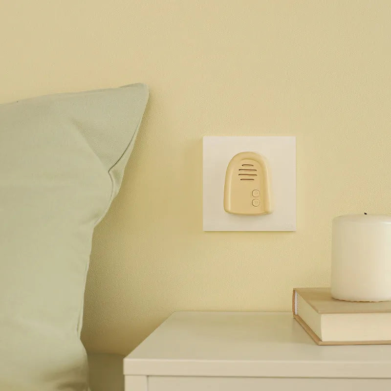 Wireless plug-in doorbell with self-generating beeper in milky yellow or white colour for household use
