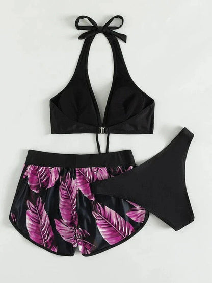 A stylish 3-piece swimsuit set featuring a unique leaf print design, including a top, bottoms, and matching shorts.