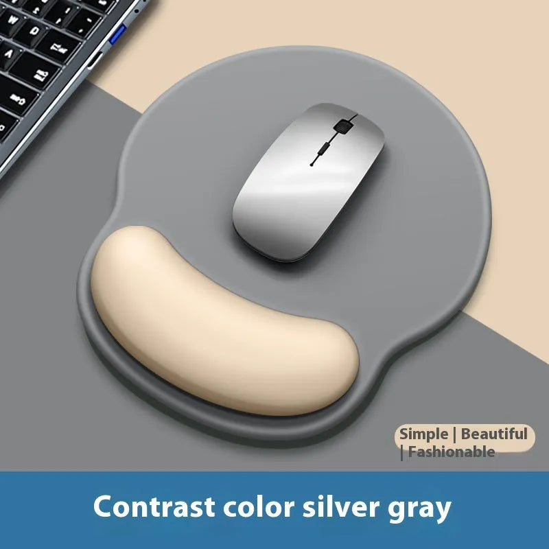 Silicone mouse mat with wristband in a gradient blue black colour pattern on a desk.