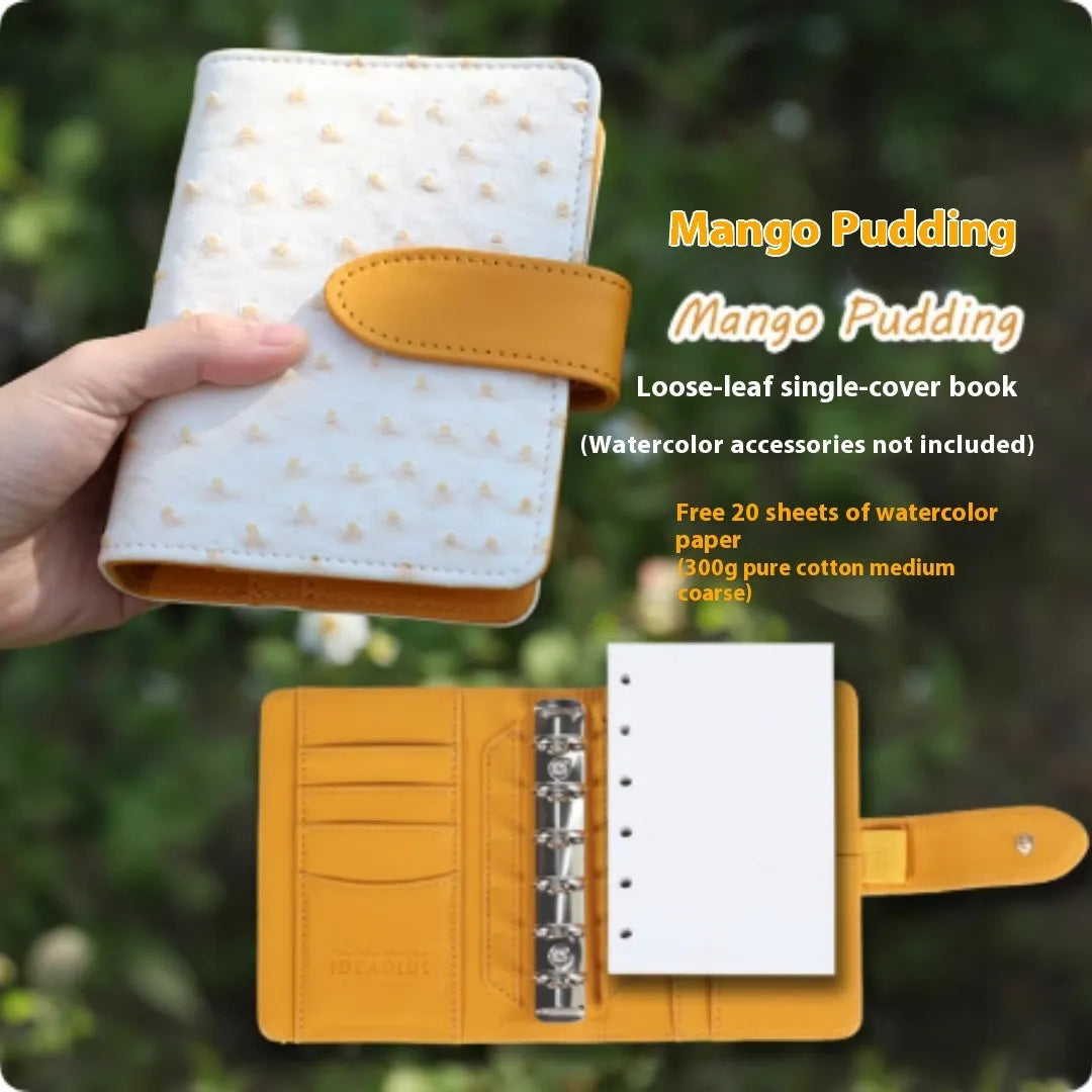 A7 sized loose-leaf watercolour notebook with textured cover, open to show flat-laying pages.