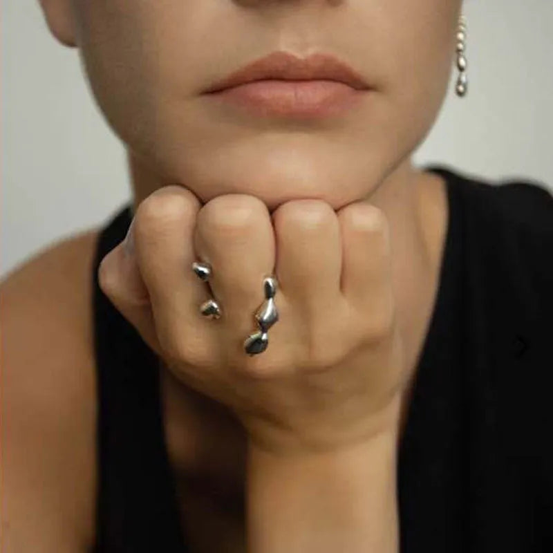 Gold and silver adjustable brass ring featuring a large spherical design on an open shank.