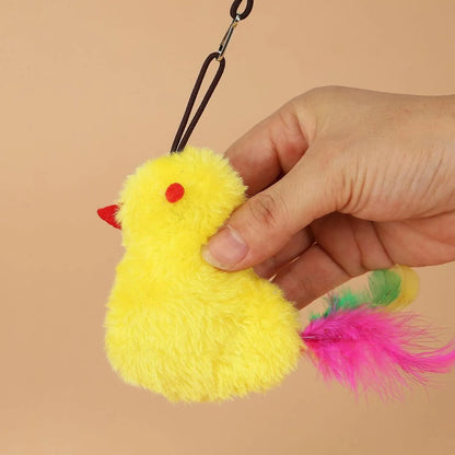Grey and yellow interactive cat toy hanging on door frame with retractable elastic rope and treat dispenser