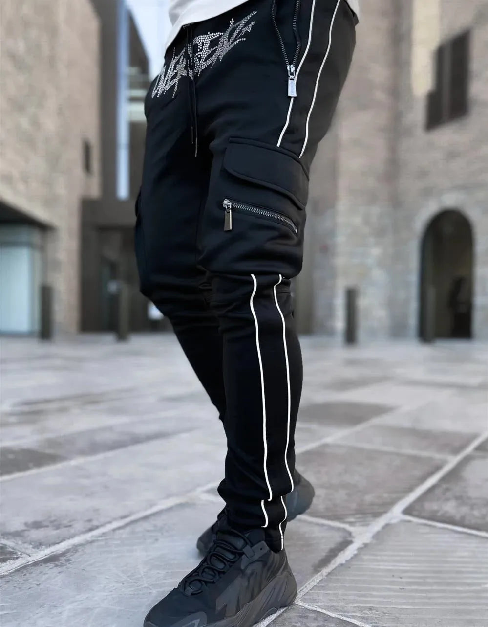 Men's multi-pocket cargo pants in khaki cotton blend with stretch fabric, mid-waist, small feet cuff, athleisure style.