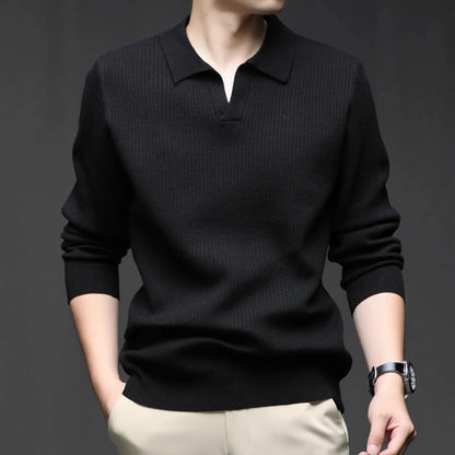 Man wearing a loose fit camel coloured pullover sweater, a casual autumn layer with a simple design.