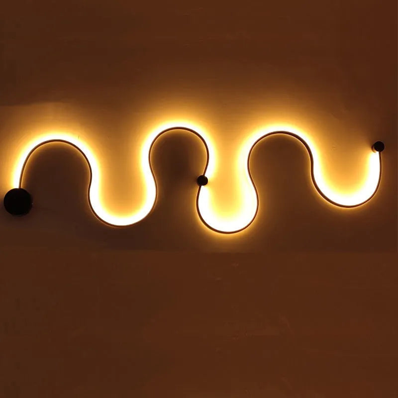 Modern black and white LED wall lamp with aluminium shade in four different sizes for bedside or corridor lighting