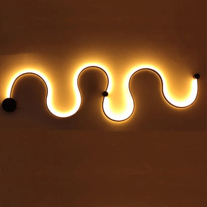 Modern black and white LED wall lamp with aluminium shade in four different sizes for bedside or corridor lighting