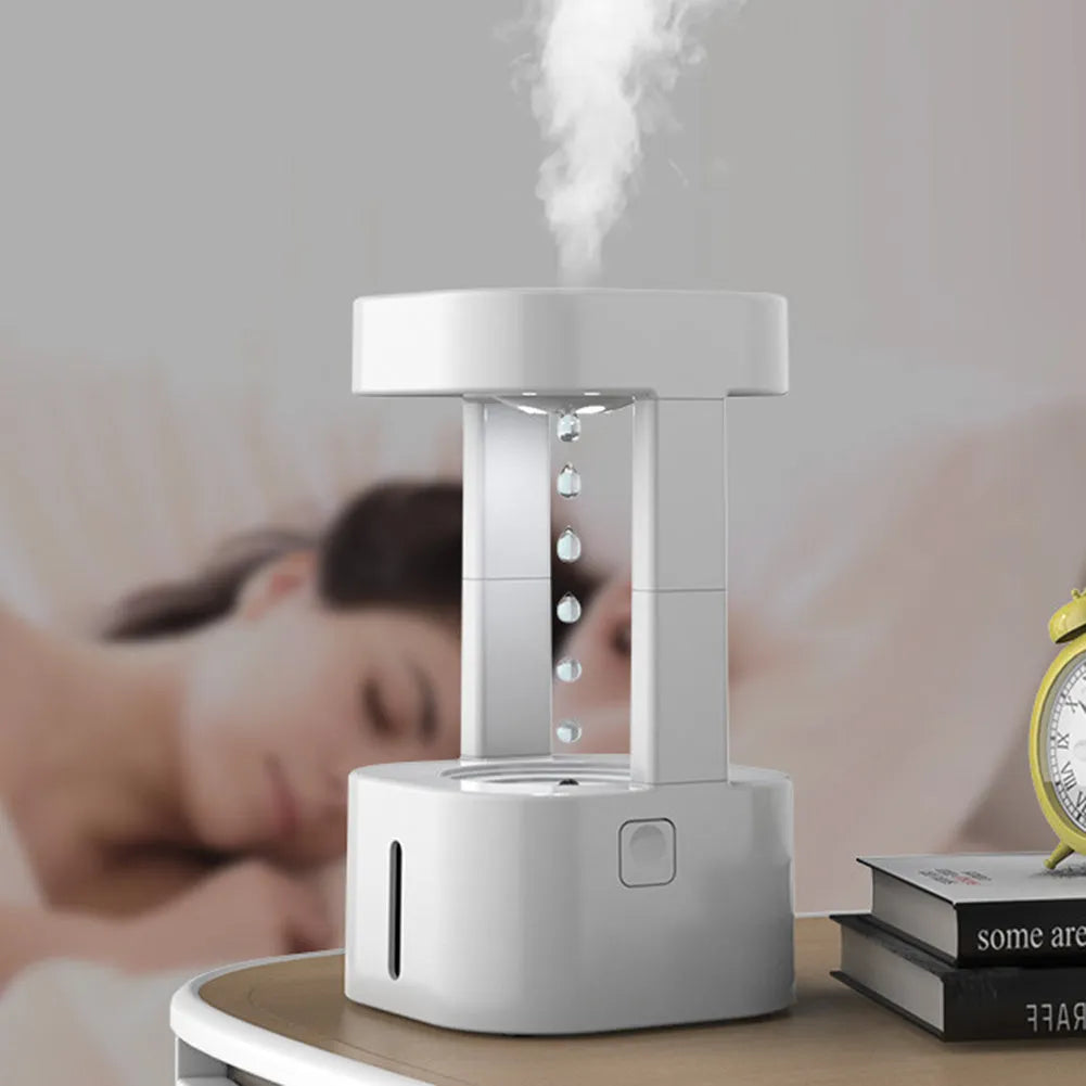 Creative anti-gravity water drop humidifier with upward flowing droplets and coloured lights