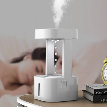 Creative anti-gravity water drop humidifier with upward flowing droplets and coloured lights