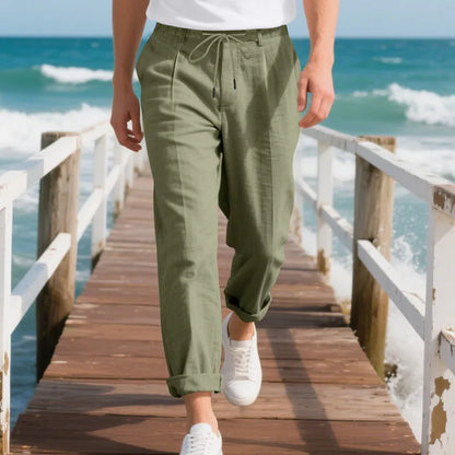 Men's light beige linen trousers with a loose straight leg and drawstring waist on a hanger.