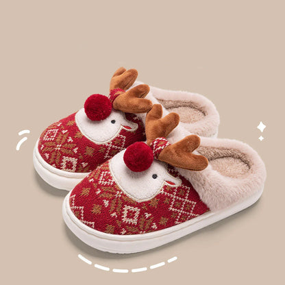 Cozy elk-inspired plush slippers in festive Christmas green and red colors, featuring a soft, comfortable upper and non-slip soles for indoor wear