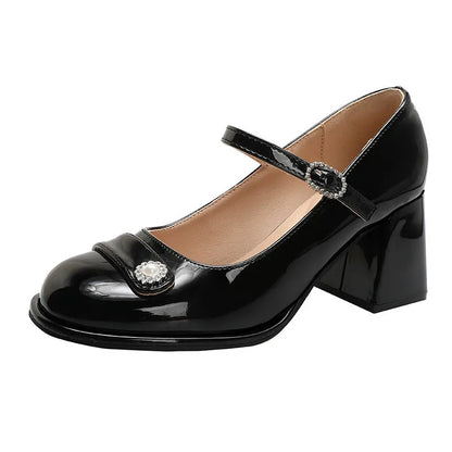 Women's black patent leather wide fit high heels with a round toe and chunky block heel.