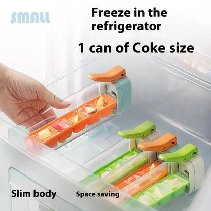 Blue press-release ice cube tray with storage box on a kitchen counter