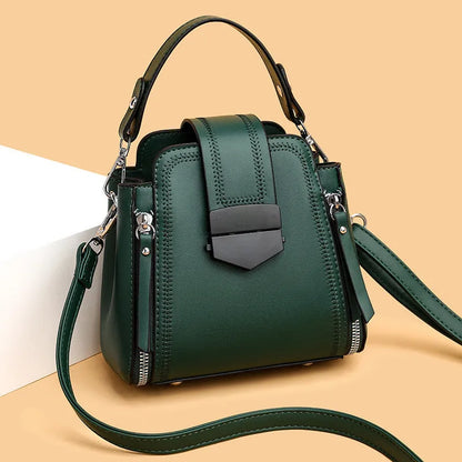Soft PU leather ladies handbag with textured surface and sewing thread detailing in square vertical shape