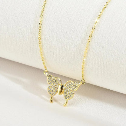 Gold titanium steel clavicle chain necklace with a magnetic butterfly pendant on a twisted chain.