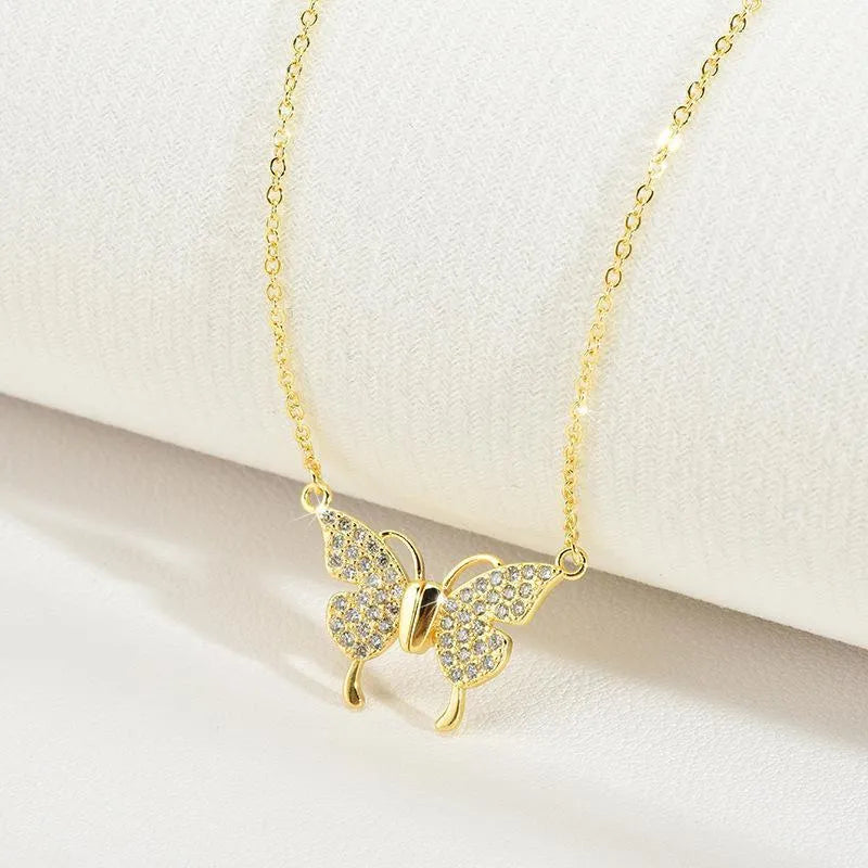 Women's clavicle chain necklace featuring a magnetic snap butterfly pendant crafted from titanium steel with a twisted chain design, available in gold and silver finishes for summer fashion and personality styling.