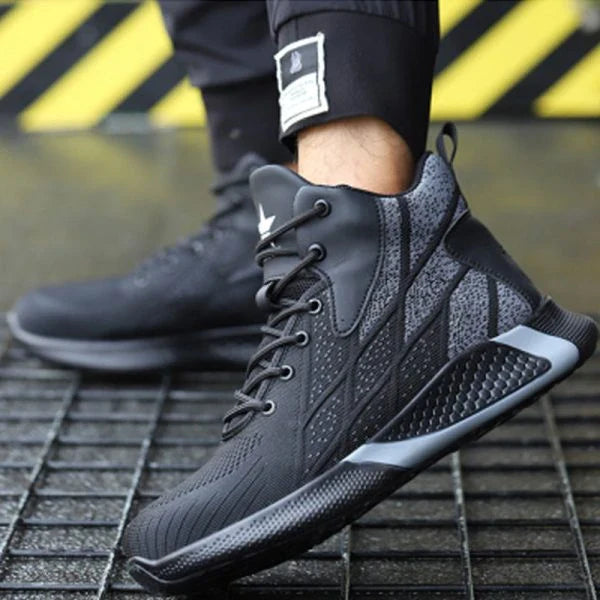 A pair of gray, red, and blue work boots with reinforced steel toes and puncture-resistant soles for superior protection and comfort.