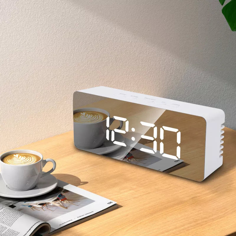 LED Digital Mirror Alarm Clock with customizable light colors on a desktop