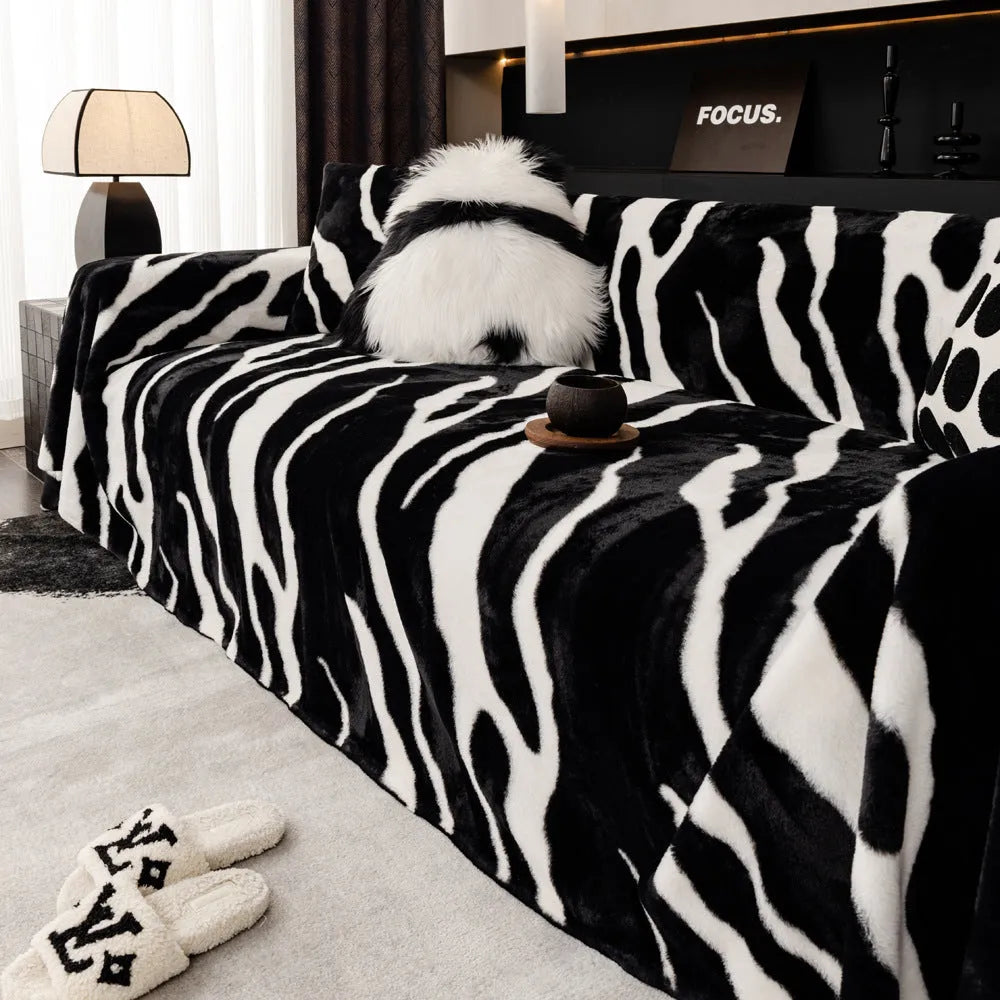 Zebra pattern sofa cover cloth in flannel fabric with non-slip backing, shown in caramel colour on a sofa