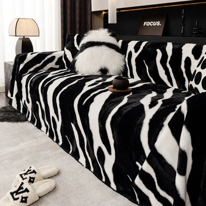 Zebra pattern sofa cover cloth in flannel fabric with non-slip backing, shown in caramel colour on a sofa