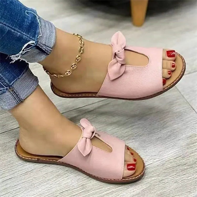 Ladies sandals with bow detailing and fish mouth design in black, pink, or gold colours