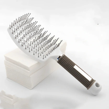 Large curved hairbrush with boar bristles showing 15cm width and natural bristle distribution