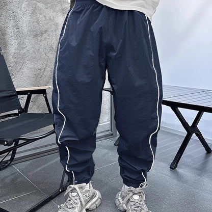 Men's bamboo fibre cropped sports trousers in army green colour showing loose fit and elastic waistband
